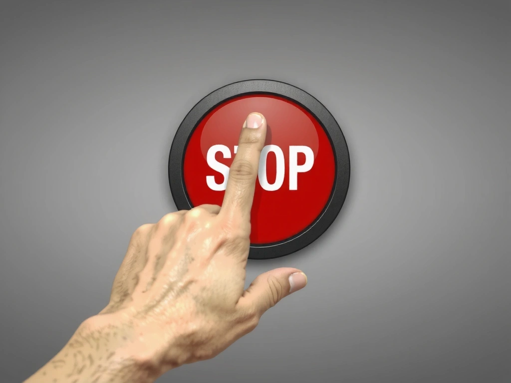 Mano che preme un pulsante di interruzione, simboleggiando la cessazione di un servizio o di un accordo.